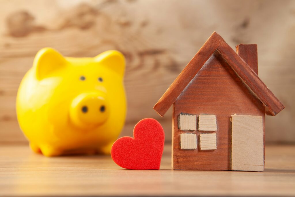 Yellow piggy bank with house representing Idaho 529 education savings plan